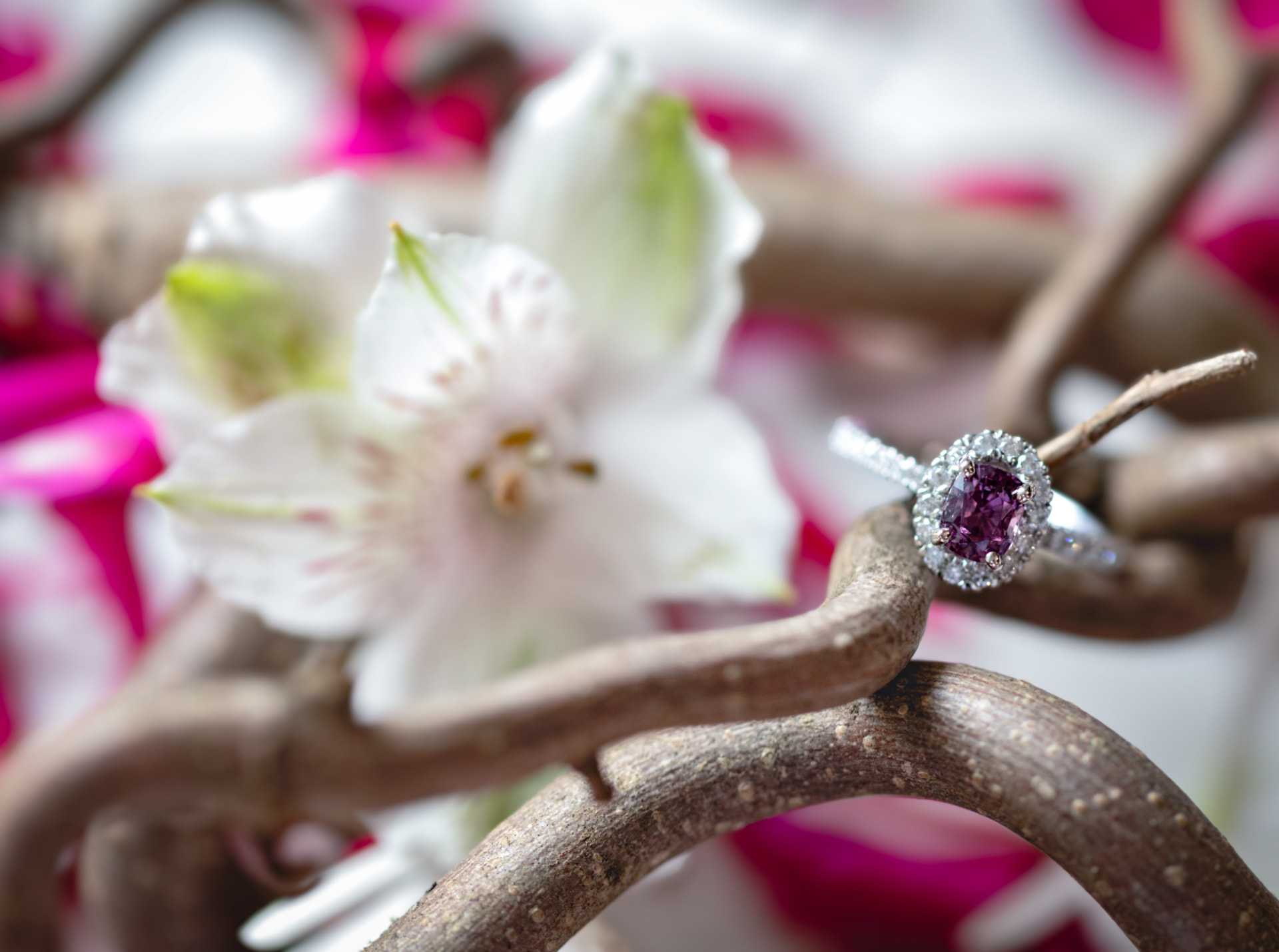 Purple gemstone halo engagement ring