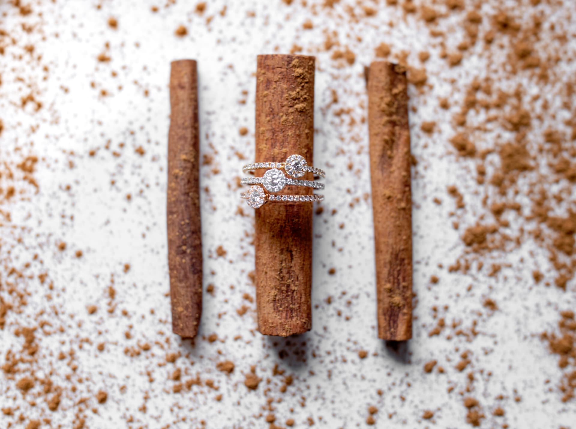 Stacked halo diamond bands in mixed golds