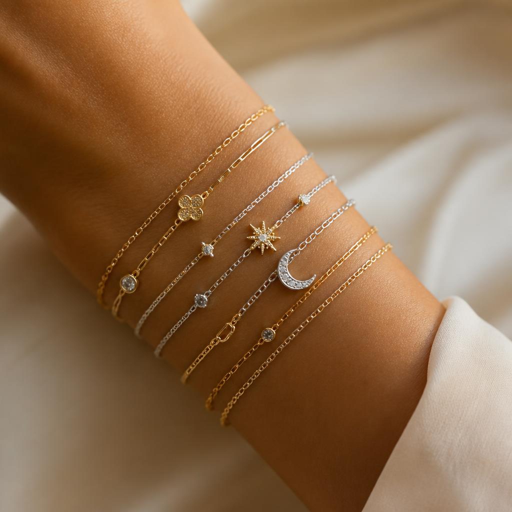 Stacked permanent bracelets with charms